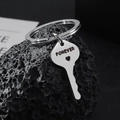 Stainless steel forever heart key keychain on a textured dark rock background - Key Style