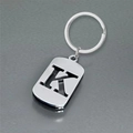 Polished stainless steel letter K keychain with hollow design on reflective surface - Polished Alphabet Letter K