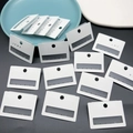 Dettaglio cartellini per gioielli in PVC bianco opaco con fori preforati per orecchini - 5*3,5cm/6 Fori / Bianco