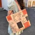Canvas tote bag in beige and orange featuring cute cartoon rabbit and bear illustrations - Sticker Rabbit