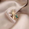 Bamboo shaped gold alloy brooch with green crystals and white enamel finish - 498# Bamboo