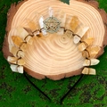 Handmade golden crystal crown headband with star charm on natural wood and moss background - Citrine + Bronze Wire + Pentagram