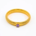 Macro view of gold snake-patterned bracelet with a rectangle purple zircon inlay - 12mmx18cm / Purple Zirconia