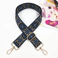 Detail of ethnic embroidered wide strap with blue floral patterns and gold metal clasps - No.6 Black with Blue Khaki / Silver Buckle