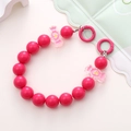 Detail of rose pink acrylic beaded phone chain with candy-shaped charms and metal hooks - Rose Red Candy Style (K1672)