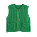 Close-up of chunky knit green vest featuring vintage resin buttons and front pockets - Green