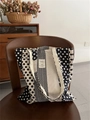 Detailed view of polka dot canvas tote bag with geometric patterns on a wooden chair - Double Shoulder Strap