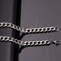 Macro shot of silver stainless steel Cuban link chain on a reflective black surface - Steel [5.0mm Width] / Length [50CM]