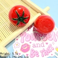 Macro shot of 3D resin tomato charms for DIY crafts showing size and 5.7g weight - Flat Tomato
