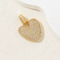 Gold plated heart pendant with pavé cubic zirconia on a minimalist textured backdrop - Letter V