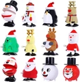 Set of 12 wind-up Christmas toys including Santa, penguin, and reindeer in plastic - Christmas Wind Up 12pcs Set E