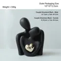 Modern black ceramic couple sculpture with a gold heart accent in minimalist style - Mini Large / Black Gold