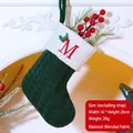 Dark green knitted Christmas stocking with white cuff and red embroidered letter M - Letter M / Dark Green
