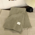 Thick khaki green ribbed knit scarf with a white brand label for winter warmth - Light Green