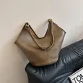 Retro tan faux leather tote bag with V-shaped opening and gold metal ring handle detail - Mud Coffee