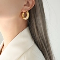 Vintage style gold twisted hoop earrings for women featuring classic textured metal design - Gold