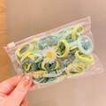 Green and yellow braided kids hair ties in a daisy themed fashion jewelry pouch - Green Series Lace 50pcs with Daisy Bag