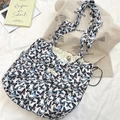 Detail shot of the butterfly print drawstring tote bag with branding on soft fabric - Double Straps with Drawstring
