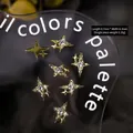 Golden mini Y2K star nail charms with white rhinestones measuring 8.7mm by 6.3mm - 2# Starburst (9*6mm)