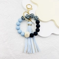 Silicone beaded wristlet keychain with blue and black beads, wood bead and leather tassel - Light Blue Leopard
