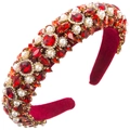 Close-up of luxury Baroque headband with red crystals and white pearls on velvet - Red