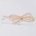 Golden hollow bow hair clip with dimensions 6.2cm by 2.2cm on a clean white background - Gold Hollow Bowknot