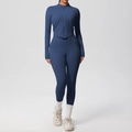Detail of navy yoga set featuring long sleeve zip jacket and high waist leggings with side pockets - S / Navy Blue