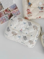 Detailed close-up of quilted coin purse featuring cute elephant and doll house prints - Elephant with Red Hat