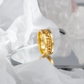 Polished gold stainless steel spinner ring with a rotating curb chain detail - All Gold