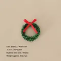 Miniature Christmas wreath variant with green tinsel and a small red ribbon bow - No.73 - 4cm Common Mini Christmas Wreath