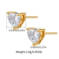 Detailed macro of heart-shaped zircon earrings in gold finish with size and weight specs - Heart Shaped Claw (KE1503)