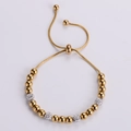 Adjustable gold snake chain bracelet featuring gold beads and white crystal pave clay balls - Gold