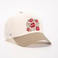 Close-up of red lip embroidery and bold letters on a color-block baseball cap - Off-White/Dark Khaki