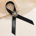 Detail of elegant black ribbon brooch with a gold-trimmed flower and pearl center - Black Satin Ribbon Flower Style (18 Black)