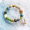 Handmade ceramic beaded bracelet with colorful charms and starfish pendant on blue plate - Ocean Starfish Style (1615-01) / Multicolor