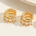 Detailed macro view of triple-layered gold ear cuff with sparkling zircon stone setting - Gold Triple Layer White Zircon Ear Cuff