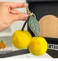Cute bright yellow cherry plush keychain with green faux leather leaves and gold buckle - Yellow
