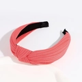 Coral pink ribbed knit headband featuring a stylish knotted design and non-slip inner grip - Watermelon red