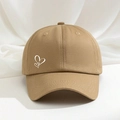 Khaki cotton baseball cap with white heart print shown on a textured fabric background - Dark Khaki