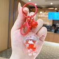 Astronaut liquid quicksand keychain in bright red finish with glitter and small bell - Small Quicksand Astronaut - Red