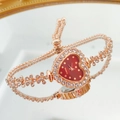 Detailed mirror view of rose gold heart-shaped watch with crystal bezel and adjustable chain - Rose Gold Red