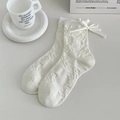 Calze bianche con orsetti in rilievo 3D e un fiocco decorativo in raso bianco - Crema