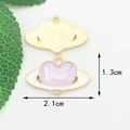 Detailed view of heart-shaped Saturn enamel pendant with lavender fill and gold edging - Purple Heart