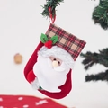 Close-up of red Christmas stocking with Santa Claus applique and plaid cuff hanging decor - Small Plaid Cuff Santa Stocking