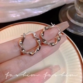 Polished silver twisted hoop earrings with a Mobius design and click-down clasp closure - A1612 Silver Wavy Twist
