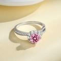 Elegant 925 sterling silver ring with a pink moissanite stone in a crossover pavé design - Pink