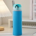 Portable blue neoprene water bottle sleeve with grey carry strap on a desk - Blue