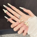 Unghie finte nude rosa con fiocchi 3D, perle e glitter, forma a mandorla - Grande (L) / Stile Stiletto (1000)