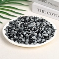 Polished black and white patterned natural quartz stone chips in a white ceramic dish - 100 Grams Of Alabaster (9-12mm)