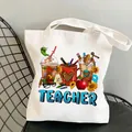 White canvas teacher tote bag with colorful stationery illustration on a black chair - Style C1